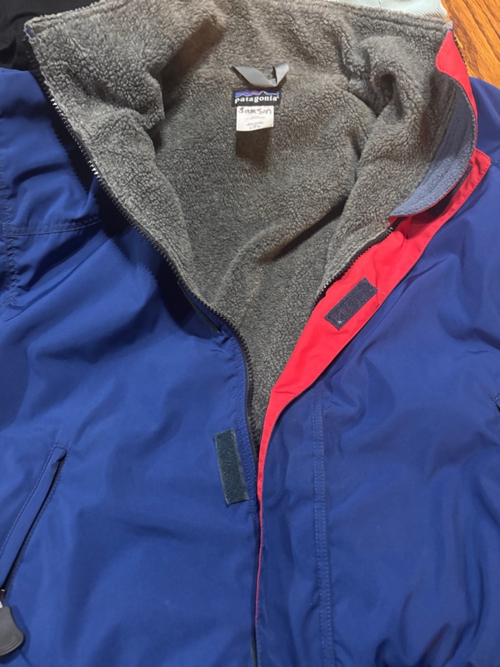 Patagonia Kids Blue Raincoat with Red Trim and Gray Fleece
